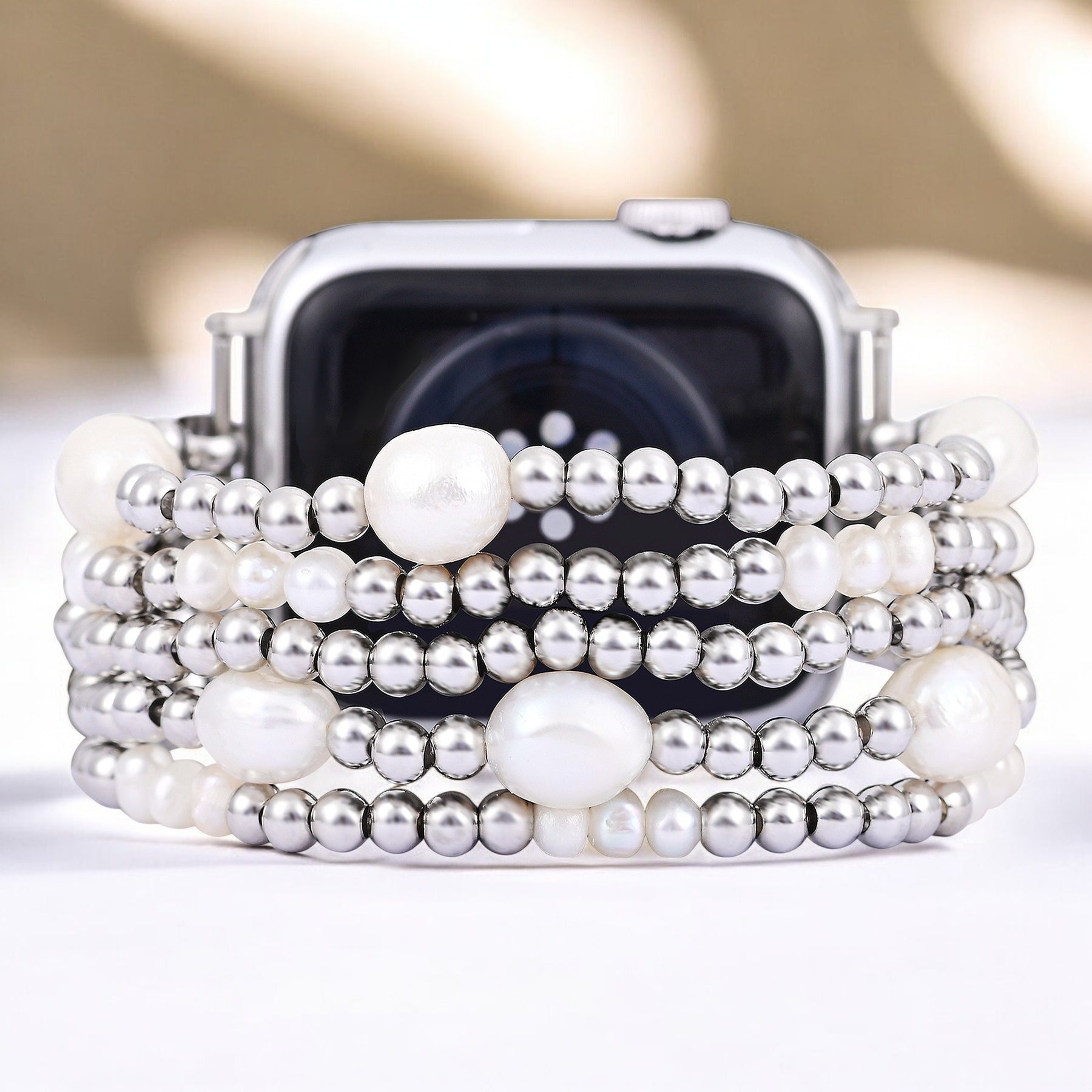 Parel- en zilverkleurige rekbare Apple Watch-band
