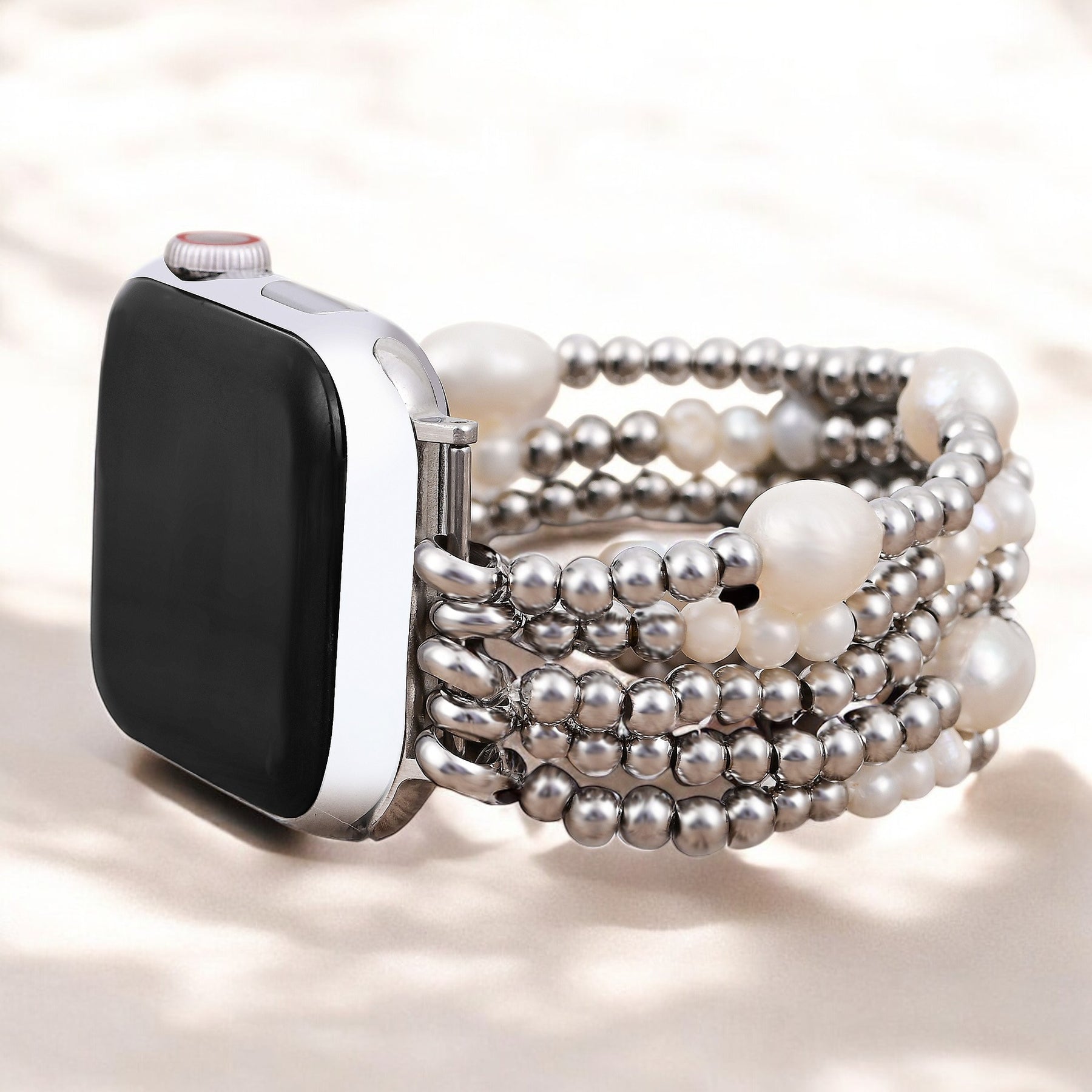 Parel- en zilverkleurige rekbare Apple Watch-band